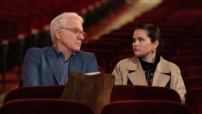 Steve Martin speaks to Selena Gomez in the audience of a theater in Only Murders In The Building